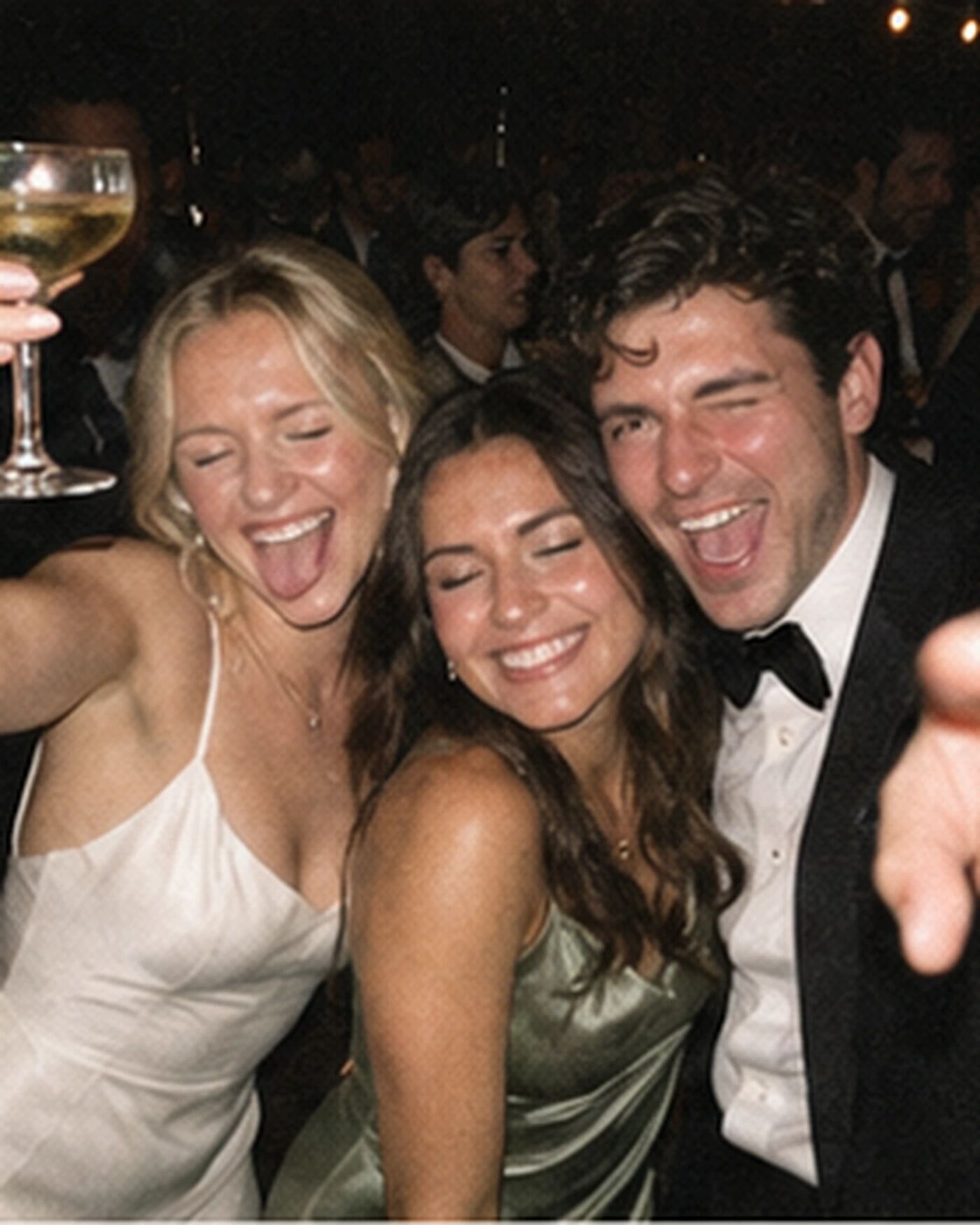 Three friends squeezed into a selfie-style photo