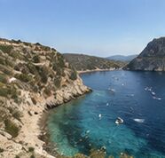 A turquoise cove from a clifftop