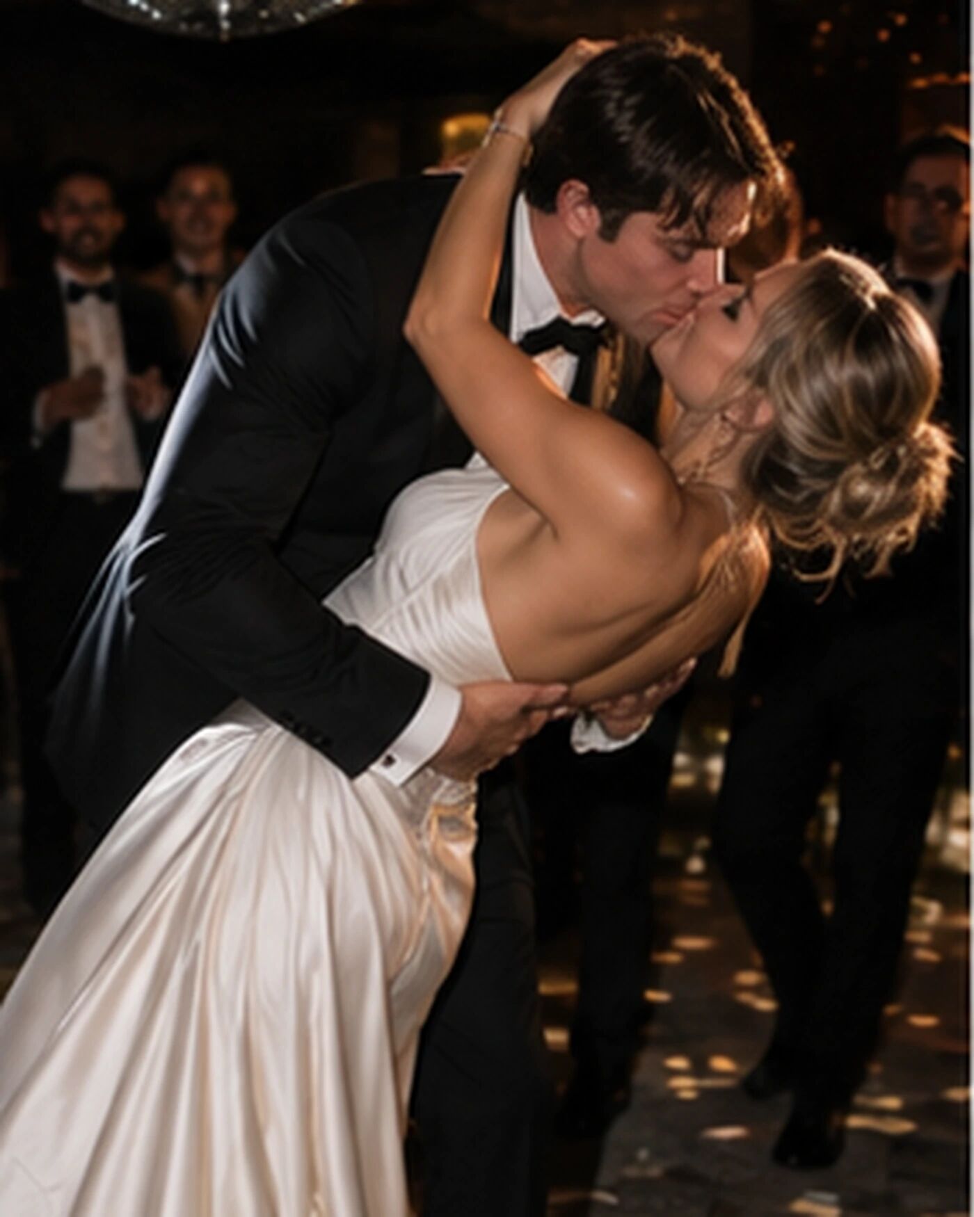 A couple kissing on the dancefloor, dipped mid-kiss